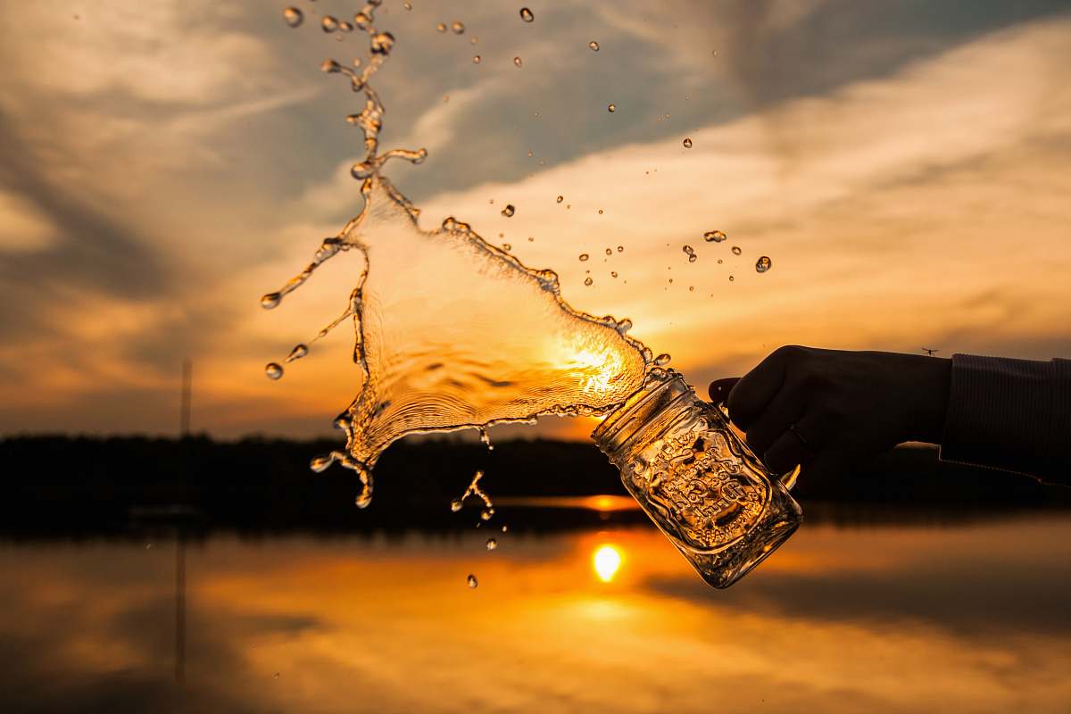 reflection silhouette photo of splash of water toss